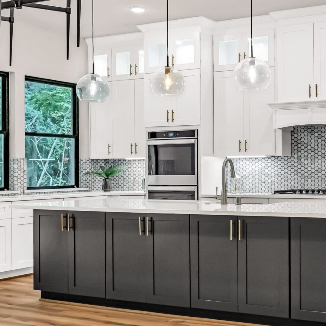 Modern kitchen island with white cabinets.