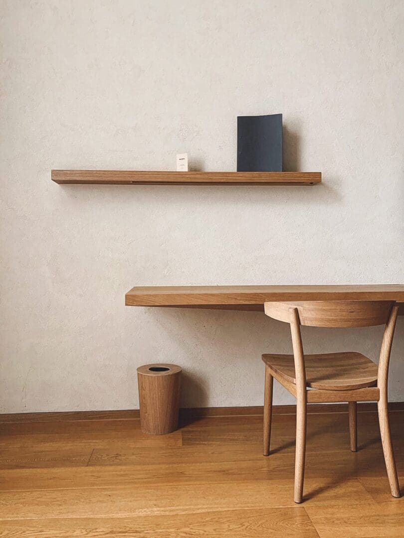 Minimalist wooden desk and chair.