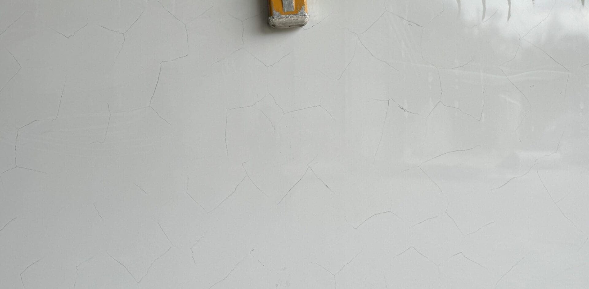 A yellow object hanging on the wall