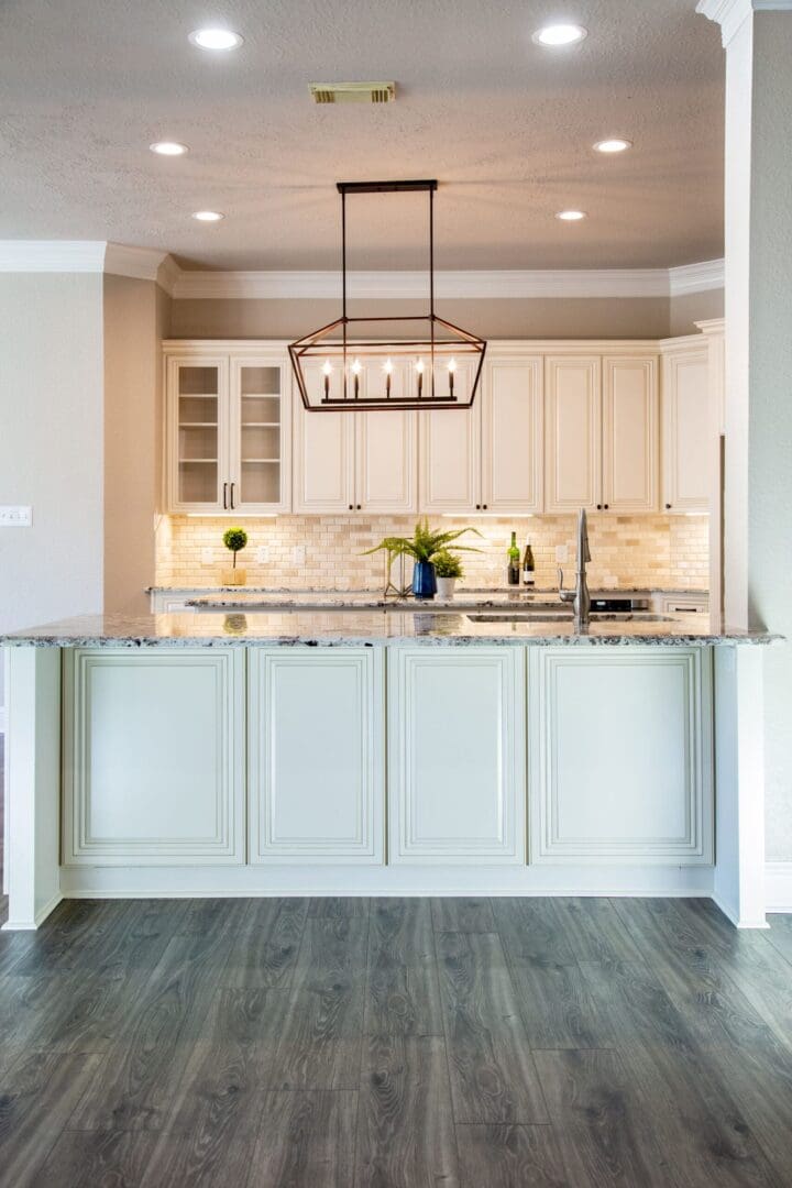 Elegant kitchen island with light cabinets.