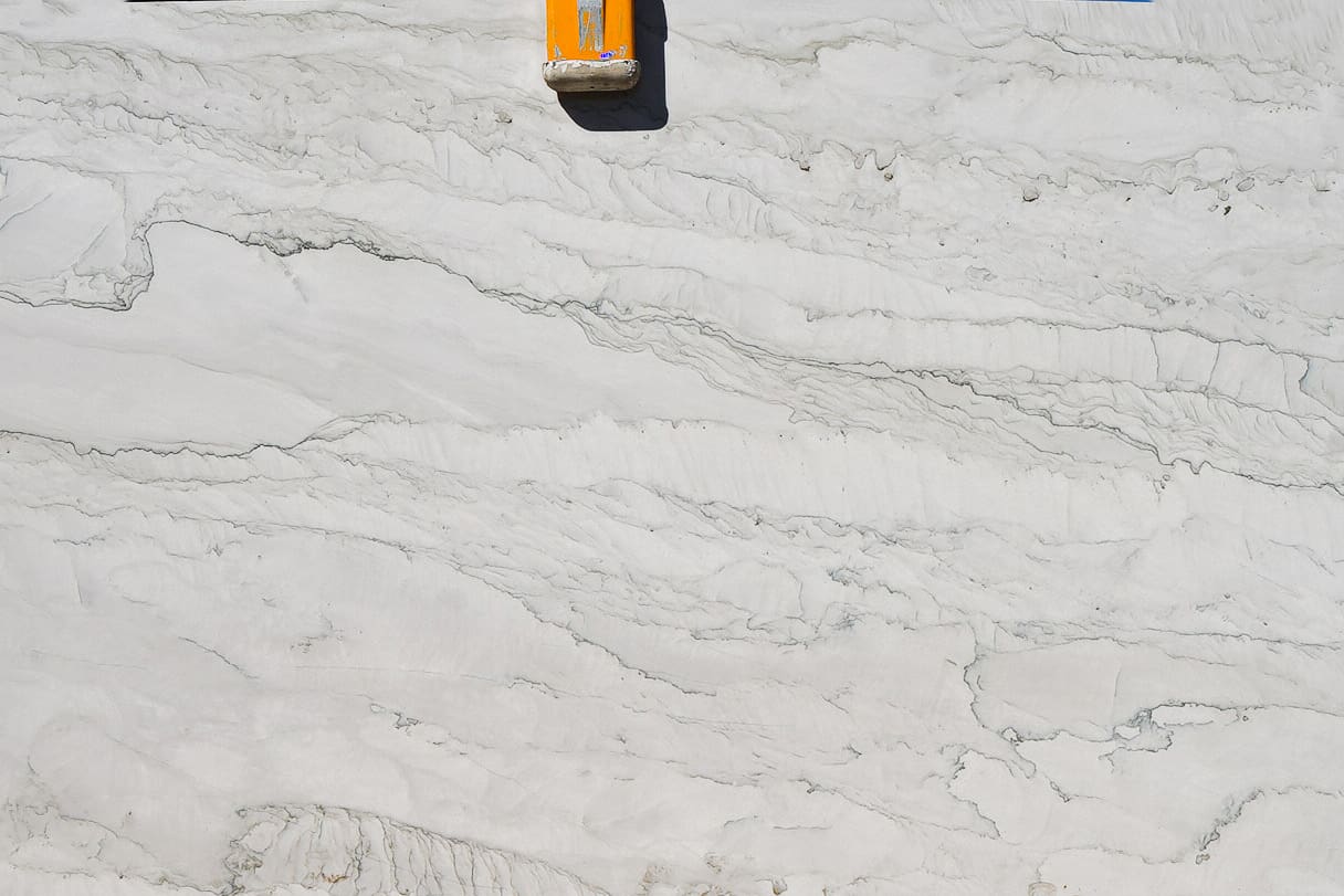 White marble slab with grey veining.